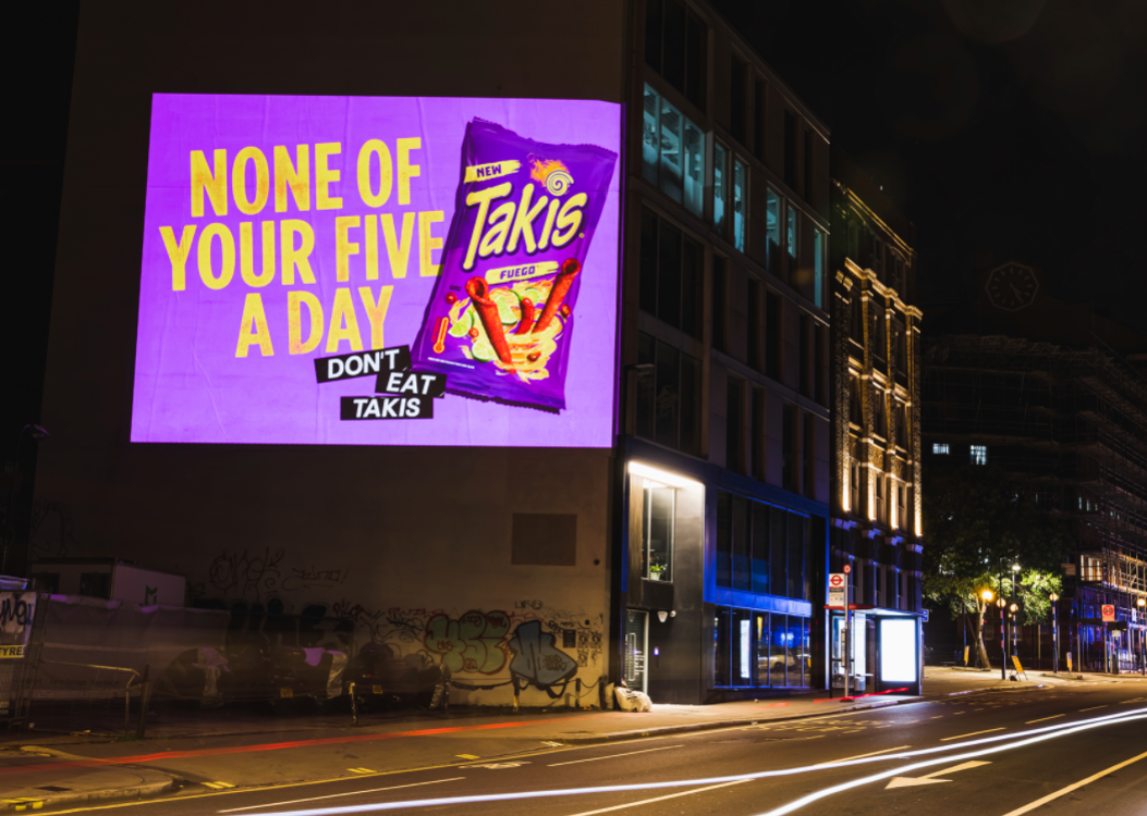 Takis advert projected onto a building